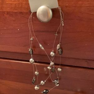 NWT NY&Co necklaces  3 strands. Different shades of silver beads.